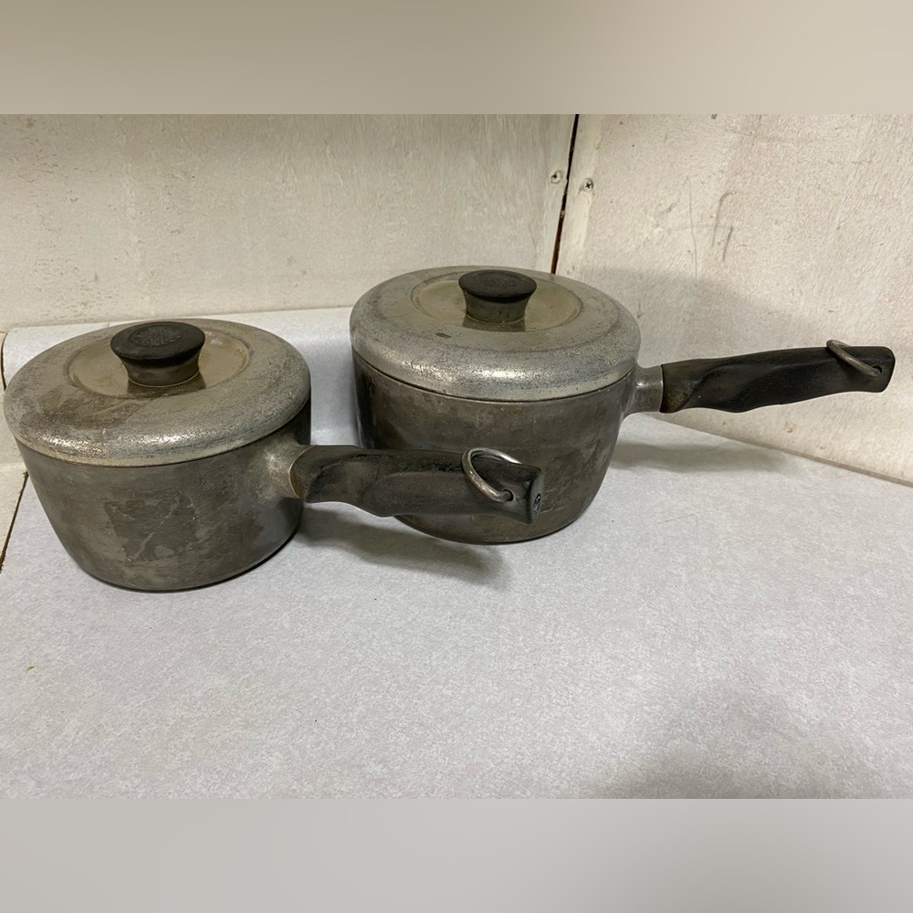 Pair of vintage WearEver aluminum pots with original lids